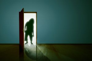 silhouette-of-zombie-standing-on-the-opened-door-1257190405_2125x1416